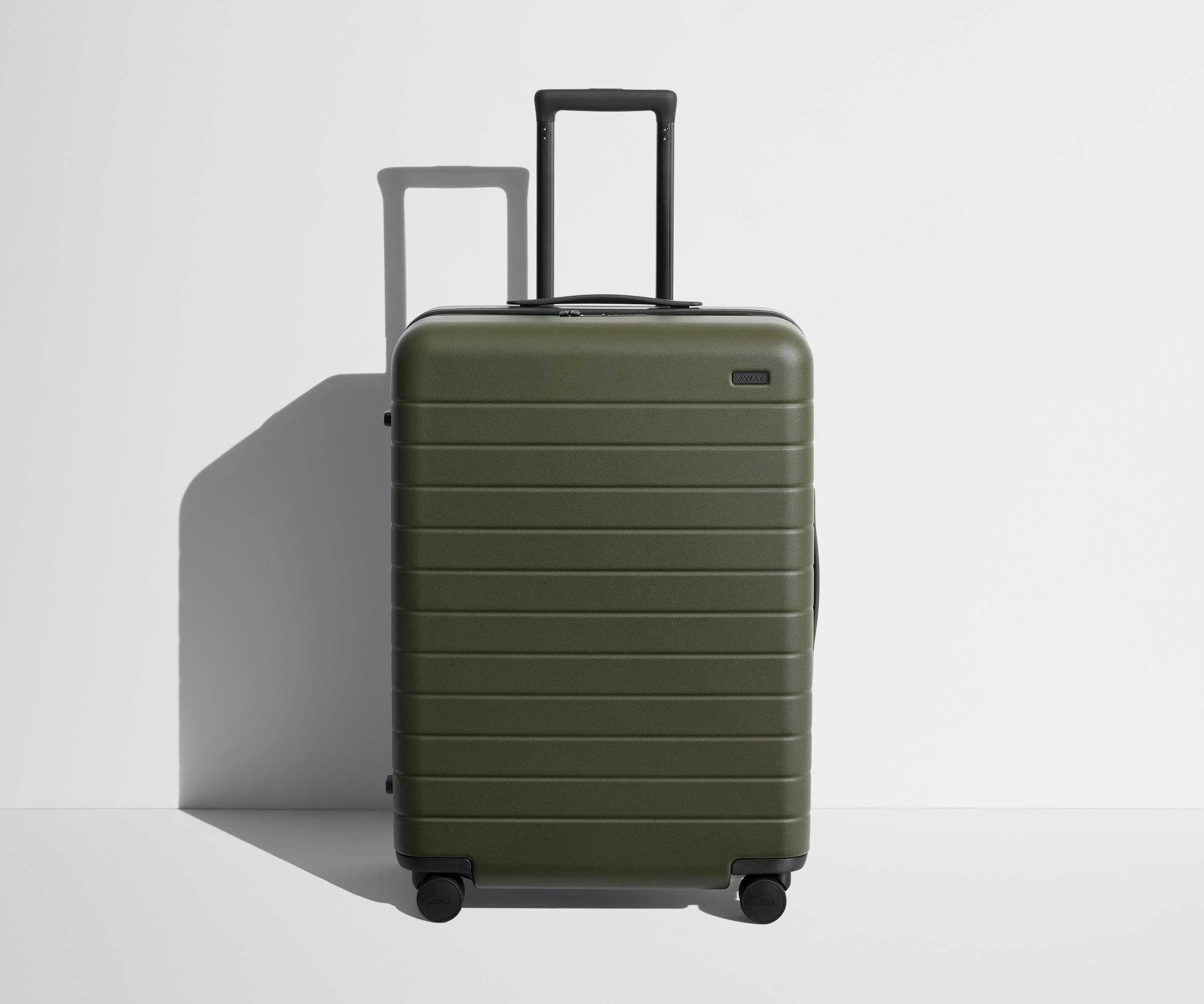 Front product view of The Medium suitcase in Olive Green with raised handle
